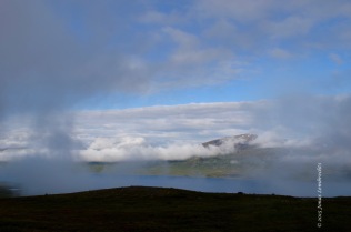 Mist disappearing over lake Torneträsk