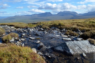 A little stream on top of the mountain, with a view on Lapporten, the gate to Lapland